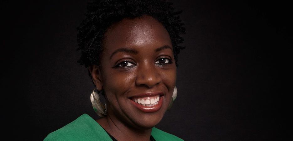 Headshot of Essé Dabla-Attikpo in green blazer